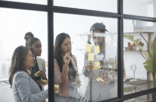 A group of office workers being trained.