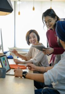 People in Office Working and Smiling 